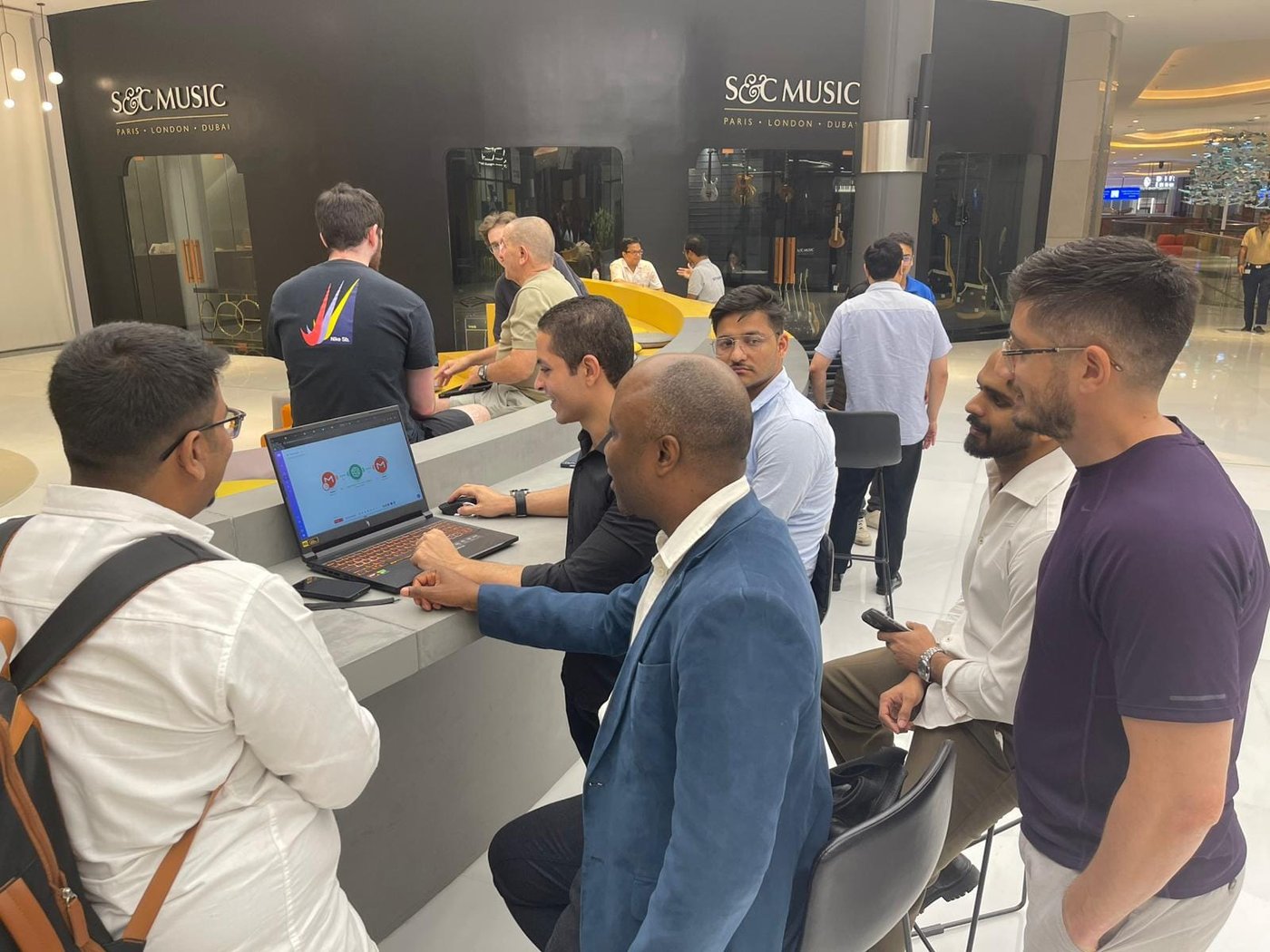 Seif Samir demoing a live AI build to a group